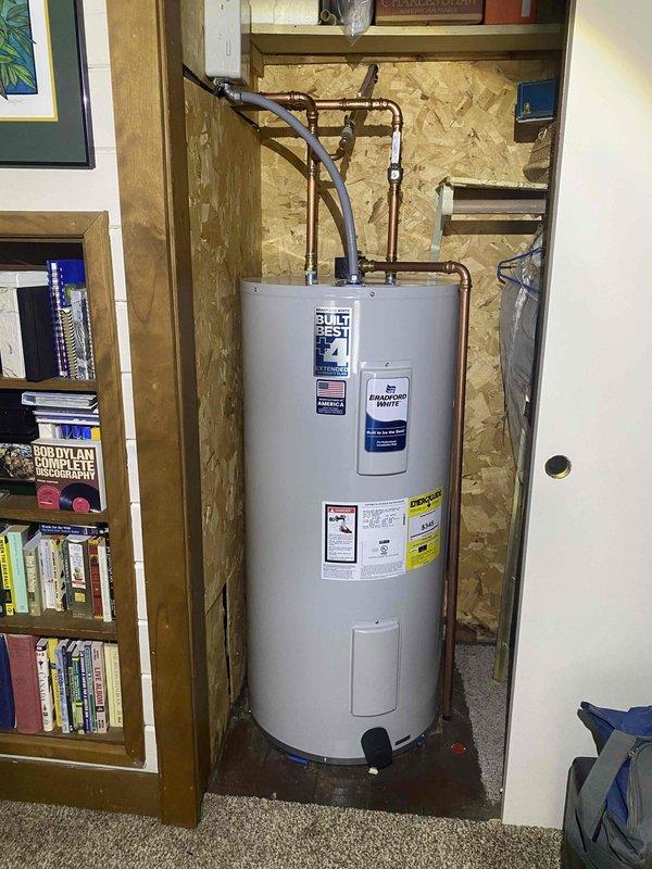 Responded to no hot water service call and discovered leaking electric water heater. Removed failed unit and installed new State brand water heater in utility closet with proper copper pipe connections, including shut-off valves. Verified proper operation of new unit before completing service.