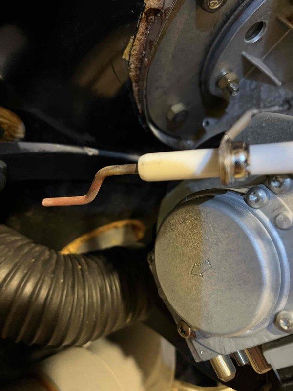 Performed annual boiler inspection and identified multiple issues including broken igniter gasket, corrosion on igniter and flame sensor, and elevated carbon monoxide levels during startup combustion. Replaced damaged igniter gasket and provided customer with estimates for recommended repairs of remaining components to restore proper system operation and safety.