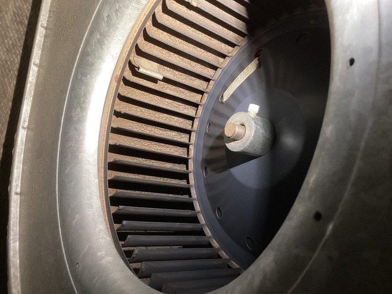 Performed annual preventative maintenance on furnace. Inspected blower assembly which showed signs of wear with rust-colored buildup on the fan blades. Removed and replaced damaged components including mounting brackets and perforated discs to restore proper system operation.