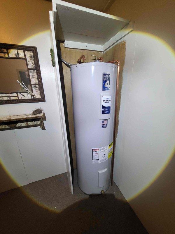 Successfully installed new 30-gallon water heater with proper copper pipe connections and shutoff valves. Repaired damaged water line that was causing water supply interruption. Completed installation of customer-supplied fixtures including sink faucets in kitchen and bathroom, showerhead, and new toilet as requested.
