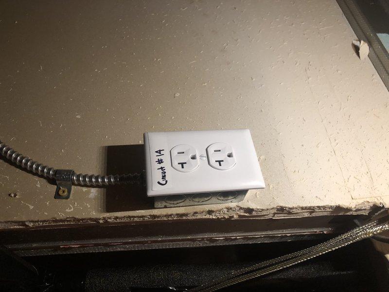 Installed a new dedicated circuit for heat tape by the water heater in the basement electrical panel. Added a new GFCI outlet labeled "Circuit 14" with appropriate conduit connection. Installed metal/plastic inserts in panel blank spaces as requested to ensure code compliance and safety.