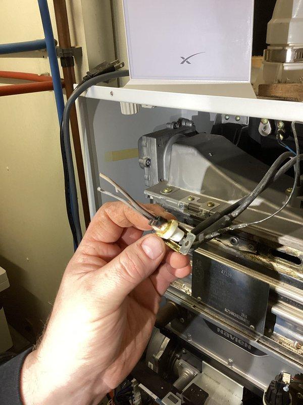 Responded to no-heat call on Navien boiler system. Diagnosed gas leak at the venturi assembly. Inspected internal components and identified defective gas connection requiring replacement parts. Customer advised of findings and awaiting approval on repair estimate.