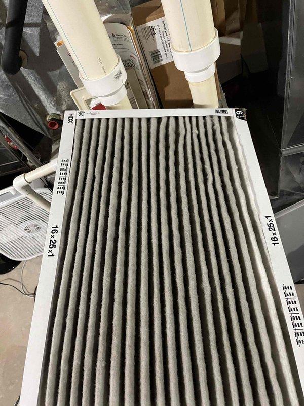 Diagnosed no heat condition on 13-year-old furnace with indoor temperature at 53°F. Identified failed flame sensor with significant dead spot and malfunctioning zone dampers. Replaced flame sensor and restored heating function. Provided customer with estimate for replacement of two sticking zone dampers. Replaced air filter during service.
