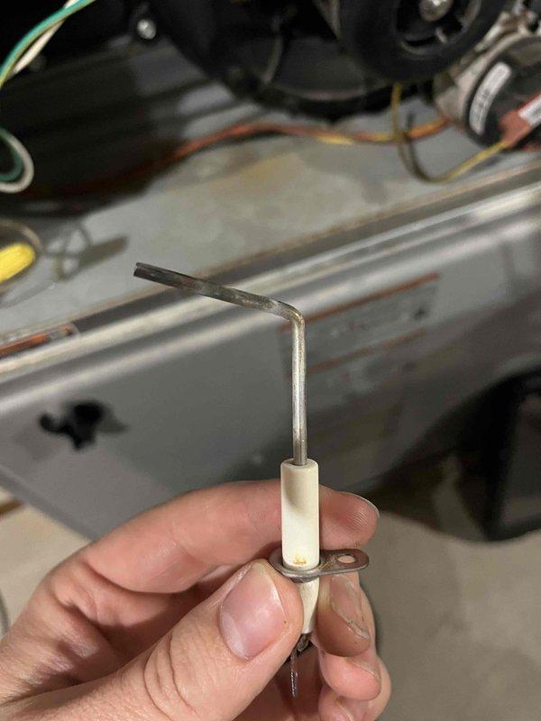 Diagnosed no heat condition on 13-year-old furnace with indoor temperature at 53°F. Identified failed flame sensor with significant dead spot and malfunctioning zone dampers. Replaced flame sensor and restored heating function. Provided customer with estimate for replacement of two sticking zone dampers. Replaced air filter during service.