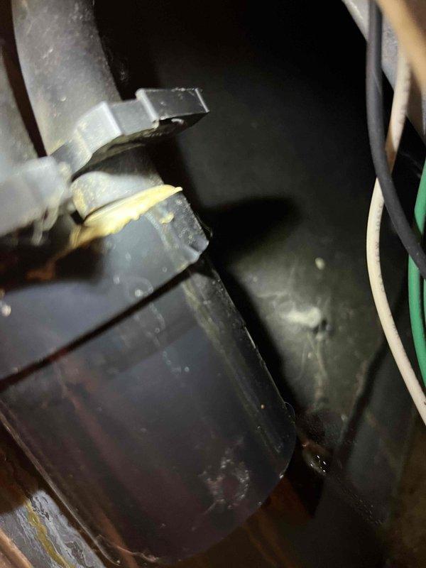 Responded to service call for furnace leaking water in basement. Identified leak at junction of condensate trap and PVC drain piping. Repaired by cementing trap to drain PVC and securing condensate lines from flue and collector box with proper crimping. Visual inspection confirmed proper repair of condensate drainage system.