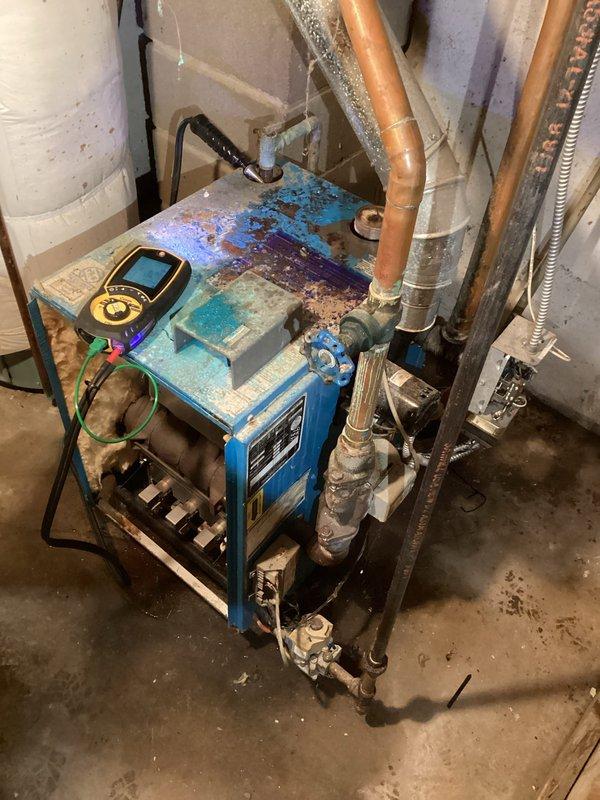 Responded to no heat call for 30-year-old natural gas boiler system. Diagnostic testing with Fieldpiece C161 clamp meter revealed system was nearly empty of water. Customer advised that due to extensive age and condition of the unit, repair options would carry no guarantee; replacement recommended as the most reliable solution.