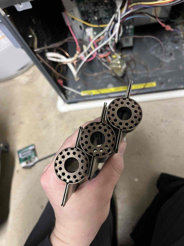 Performed Partner Plan annual heat inspection on furnace and identified multiple issues including bad flame sensor, aged igniter, corroded burners, high current inducer with noise during ramp down, and excessive blower vibration. Replaced flame sensor and scheduled comfort advisor consultation for additional repairs needed due to component deterioration and significant dust/debris accumulation observed throughout system.