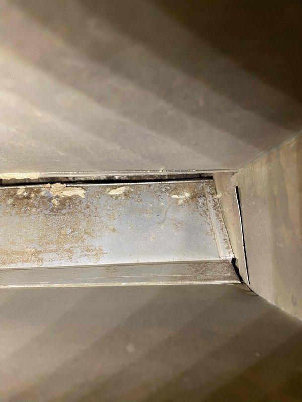 Performed comprehensive duct cleaning service as sold, addressing significant dust and debris accumulation visible throughout the ventilation system. Removed and thoroughly cleaned blower assembly to restore proper airflow and system efficiency. Photographic documentation confirmed successful removal of contaminant buildup from sheet metal surfaces and duct seams.