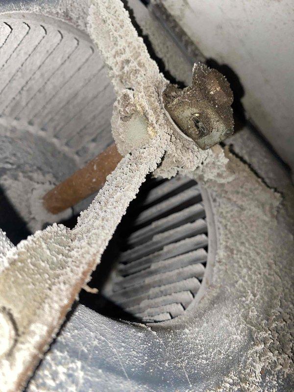 Diagnosed and replaced failed blower motor in aging furnace that was smoking and non-operational. Extensive dust buildup was found throughout the system, particularly on the blower assembly, indicating lack of regular maintenance. System was thoroughly cleaned and tested for proper operation after motor replacement.