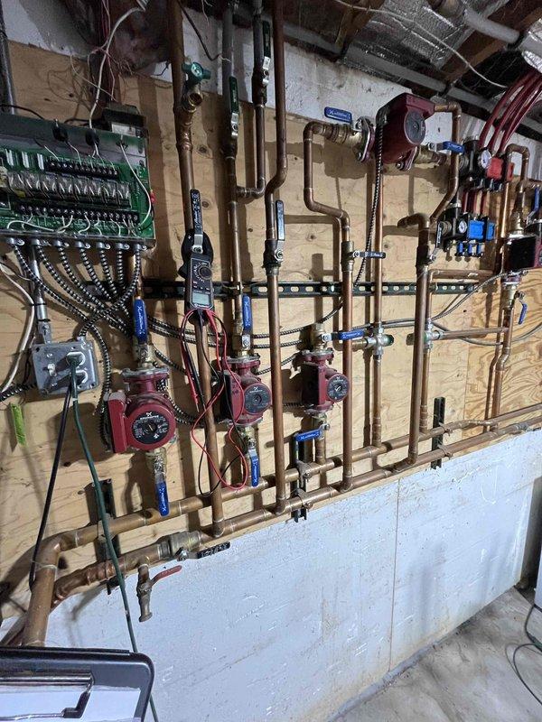 # Service Summary

Completed annual Partner Plan heat inspection on residential boiler system. Performed comprehensive evaluation of multi-zone hydronic heating system including boiler operation, circulation pumps, zone valves, and associated components.

# Work Performed

Conducted thorough inspection of boiler and heating system per annual maintenance protocol. Evaluated burner assembly and identified electrode wear requiring attention. Inspected expansion tank and discovered active weeping at test port connection indicating seal failure. Documented conditions with photographs for customer records.

Tested boiler firing sequence, flame characteristics, and safety controls. Verified proper operation of multiple zone circulators and checked system pressures throughout hydronic piping network. Inspected copper piping distribution system, zone valves, and isolation valves for leaks or deterioration. Confirmed electrical control panel connections and circuit integrity.

Assessed system co