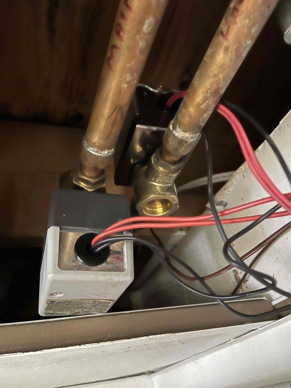 Responded to no heat call on basement zone circuit with inadequate heating throughout residence. Upon inspection, discovered bent R terminal prong on thermostat preventing proper contact and faulty zone valve end switch failing to send signal to heating system. Straightened and repaired thermostat terminal connection, then replaced defective zone valve assembly to restore proper operation and heat distribution to affected zone.