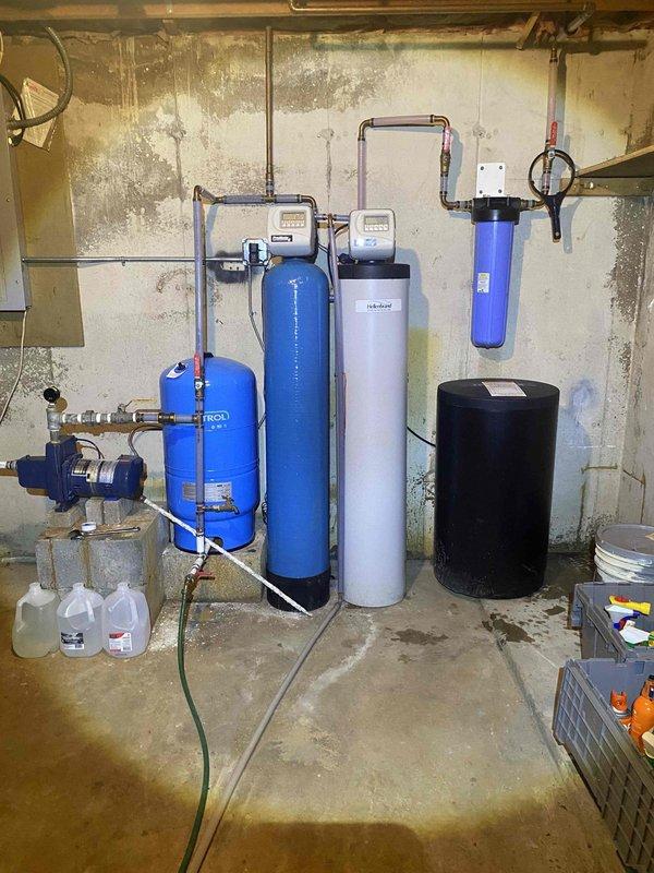 Completed annual prepaid maintenance inspection on water conditioning system, including acid neutralizer, water softener, and filtration components. Identified multiple issues affecting system performance across all three units: acid neutralizer showing signs of media depletion and potential control valve malfunction, water softener exhibiting brine tank irregularities and resin bed concerns, and filter housing displaying wear on seals and mounting hardware. Documented all equipment conditions with photographs and provided comprehensive estimates for both repair options and full replacement considerations to restore proper water treatment functionality.