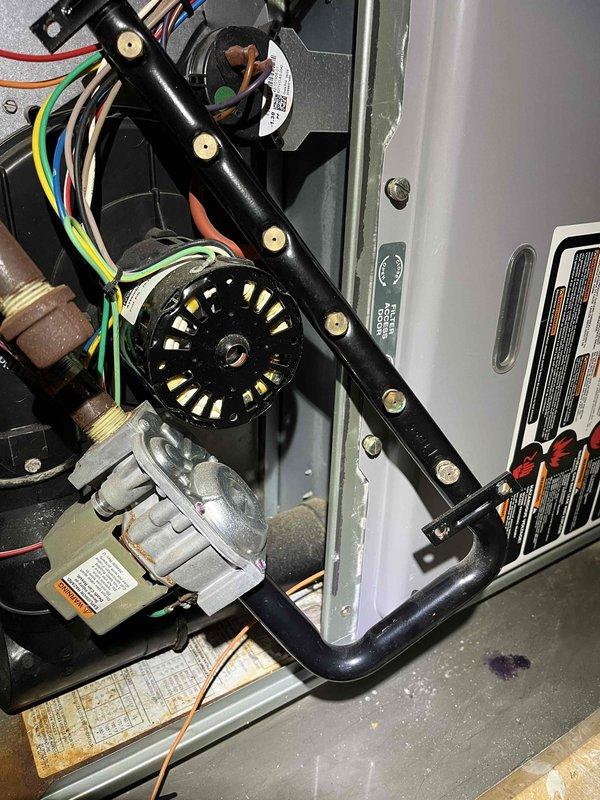 Responded to no heat call on 20-year-old furnace unit. Upon inspection, identified multiple critical component failures including corroded burners, igniter, and flame sensor. Inducer motor found drawing amperage higher than rated specifications, and inducer capacitor tested out of spec. Documented all failing components with photographs showing extensive corrosion on burner assembly and deteriorated condition of internal components. Due to age of unit and extent of required repairs, provided estimates for necessary work and scheduled comfort advisor consultation for system replacement evaluation.