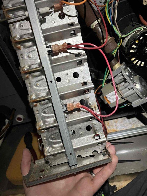 Responded to no heat call on 20-year-old furnace unit. Upon inspection, identified multiple critical component failures including corroded burners, igniter, and flame sensor. Inducer motor found drawing amperage higher than rated specifications, and inducer capacitor tested out of spec. Documented all failing components with photographs showing extensive corrosion on burner assembly and deteriorated condition of internal components. Due to age of unit and extent of required repairs, provided estimates for necessary work and scheduled comfort advisor consultation for system replacement evaluation.