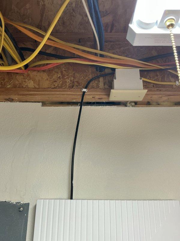 Installed dedicated electrical circuit for mini-split system as specified in approved estimate. Ran new circuit wiring through exposed ceiling joists to designated location, installed junction box, and completed all necessary connections to support split unit operation. Provided customer with installation options and completed work according to electrical code requirements.
