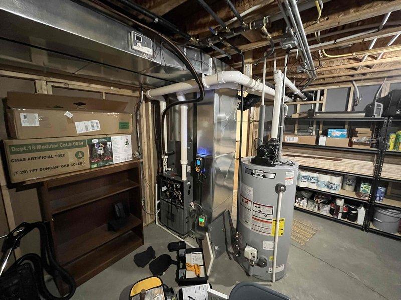 Completed annual inspection on 8+ year old furnace system. During diagnostic testing, identified inducer motor drawing high amperage, indicating potential failure risk. Documented inadequate heating in basement area and noted customer's interest in additional ductwork installation to improve comfort and airflow distribution. Captured photographic documentation of existing HVAC equipment, water heater, utility area layout, and finished basement spaces to assess ductwork routing options. Provided estimates for necessary repairs and improvements. Scheduled comfort advisor consultation to discuss heating deficiency solutions and ductwork expansion project.