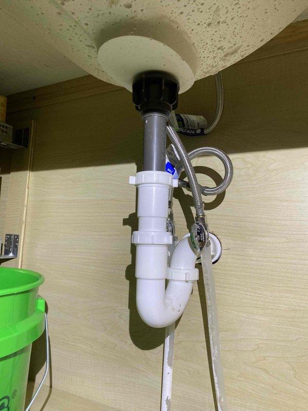 Installed 4.5" x 20" Big Blue wall-mounted filter housing with 3-valve bypass assembly and 25/5 micron dual gradient string wound filter cartridge to accommodate future filtration adjustments for ferric iron if needed. Installed Water Right IMP-1054 water softener system with brine tank, loaded with 200 lbs of salt, and routed discharge line to floor drain. Ran 1/2" PEX hard water line to existing outdoor faucet with new control valve to maintain untreated water access. Installed two owner-supplied bathroom faucets with included drain assemblies, ensuring proper connections to existing supply lines and waste piping. Modified dryer exhaust venting to position ductwork closer to floor joists, reusing existing materials where possible to minimize waste. All plumbing connections tested for proper operation and verified leak-free performance. Systems operational and ready for use.