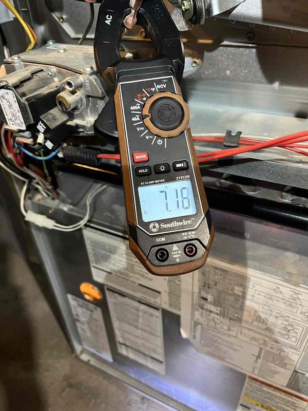 Responded to service call for furnace with intermittent heating and repeated shutdowns occurring over several years. Performed diagnostic testing revealing inducer motor drawing high amperage (7.18A and 10.65A measured), corroded flame sensor and igniter assembly, and potential backdraft condition affecting safe operation. Documented equipment condition with photos and provided repair estimates; comfort advisor scheduled to discuss replacement options with customer.