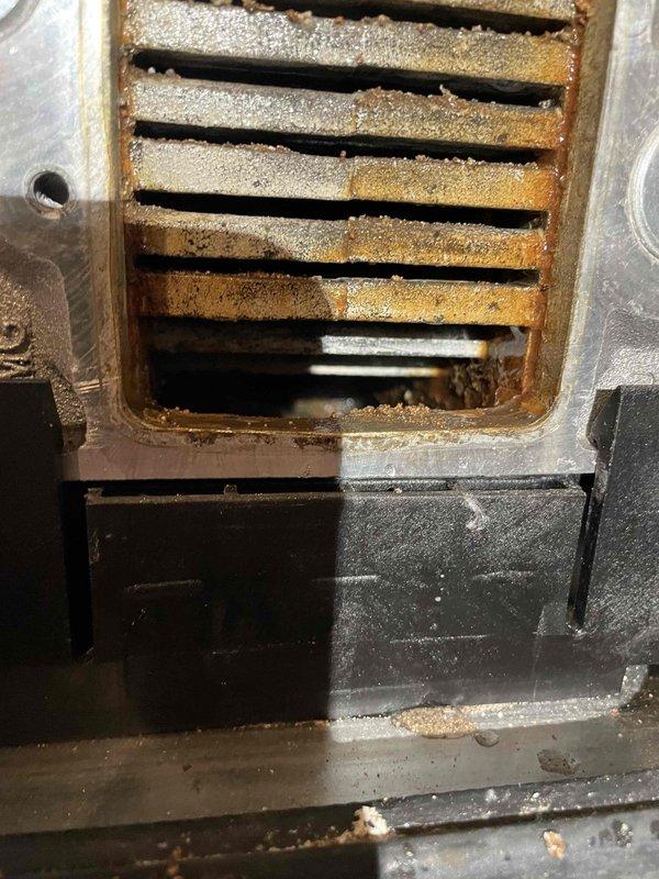 Completed annual prepaid maintenance inspection on boiler system. Upon inspection, discovered heat exchanger failure with extensive rust and corrosion throughout the finned coil assembly, compromising system integrity and safety. Documented equipment condition with photographs showing deteriorated heat exchanger fins with heavy oxidation and pressure gauge reading approximately 15 PSI. Informed customer of failed component requiring repair or replacement to restore safe operation.