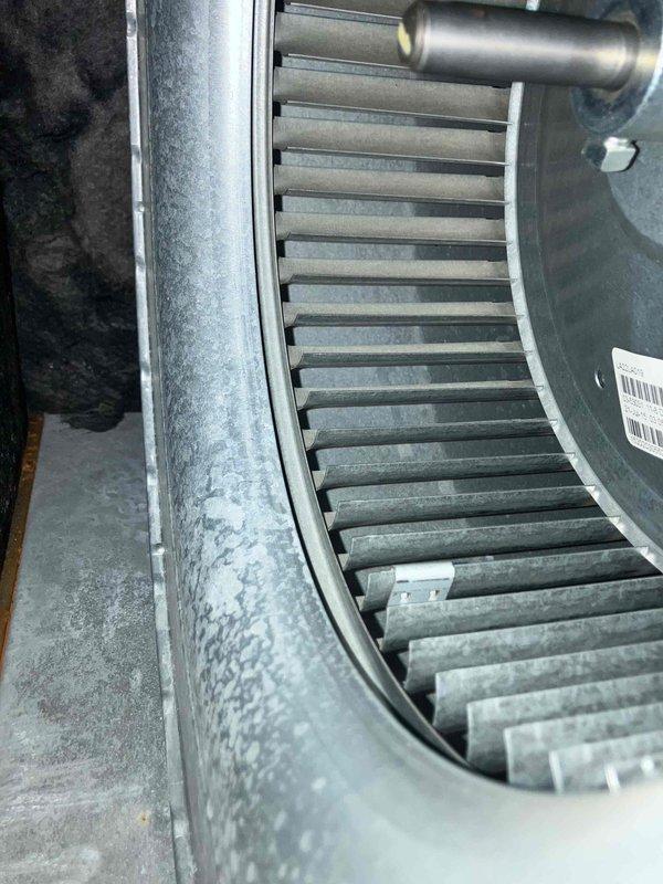 Performed annual inspection on 12+ year old furnace that had not been serviced in four years. Found condensate pump inoperative, burners heavily corroded with rust, and flame sensor with significant deterioration. Documented conditions with photos showing dust accumulation on blower wheel assembly and severely rusted burner components. Provided immediate repair and preventive maintenance recommendations to address safety and operational concerns.