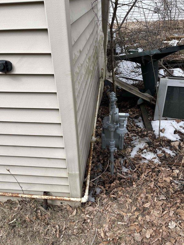 Responded to gas leak emergency at residential property with locked meter. Found missing gas pipe section between exterior connection and meter, creating dangerous open gas line condition. Installed new 1-inch gas pipe from exterior connection point to meter and secured all fittings. Located and plugged open gas fitting inside residence to prevent gas infiltration into living space. Coordinated with utility company for meter lock removal. Scheduled follow-up visit for comprehensive leak testing to verify system integrity and ensure safe operation of gas service.