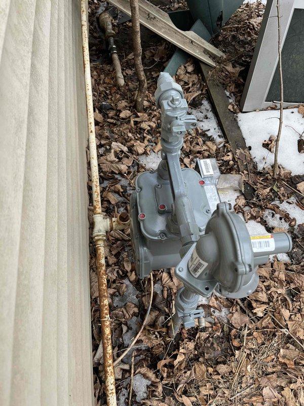 Responded to gas leak emergency at residential property with locked meter. Found missing gas pipe section between exterior connection and meter, creating dangerous open gas line condition. Installed new 1-inch gas pipe from exterior connection point to meter and secured all fittings. Located and plugged open gas fitting inside residence to prevent gas infiltration into living space. Coordinated with utility company for meter lock removal. Scheduled follow-up visit for comprehensive leak testing to verify system integrity and ensure safe operation of gas service.