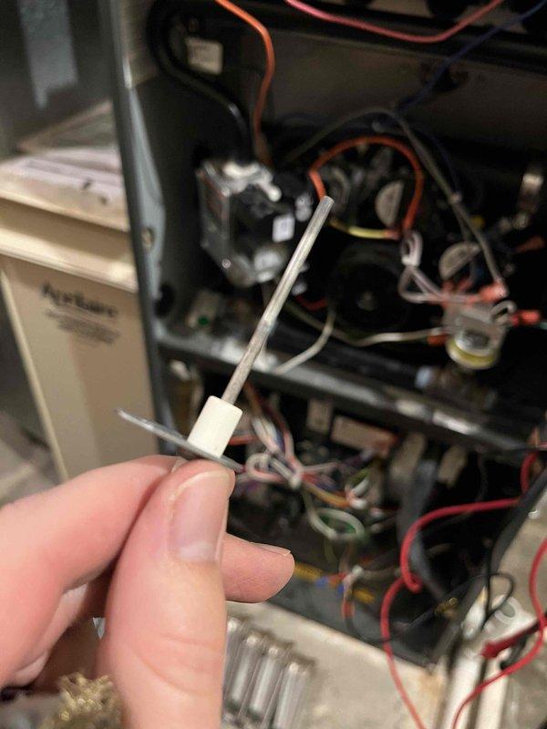 Completed annual partner plan inspection on furnace and identified multiple maintenance concerns requiring attention. Found corroded burners, flame sensor with dead spot, aged igniter, UV light needing replacement, and active water leak at exhaust elbow. Documented all findings with photos and provided repair estimates to address the identified issues.