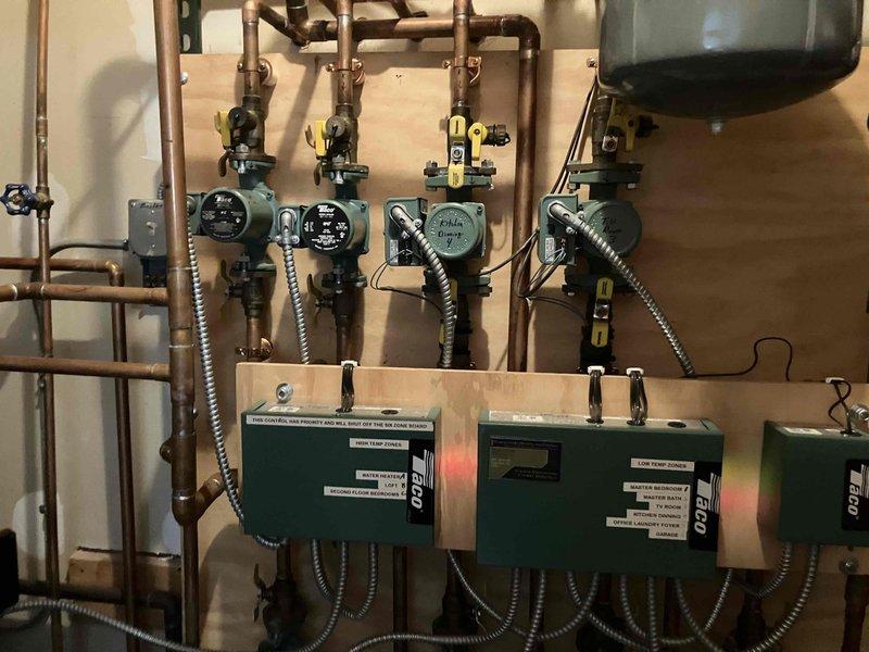 Completed annual preventive maintenance on residential hydronic heating system and indirect water heater. Performed comprehensive inspection of multi-zone heating system including four circulation pumps, zone control boards, copper piping network, expansion tank, and associated ball valves. Inspected indirect water heater and all connections, verified proper operation of pressure relief valve and system controls. All components found operating within normal parameters. Provided estimate for recommended services. Customer requested second annual maintenance visit be scheduled for fall season prior to heating demand period.