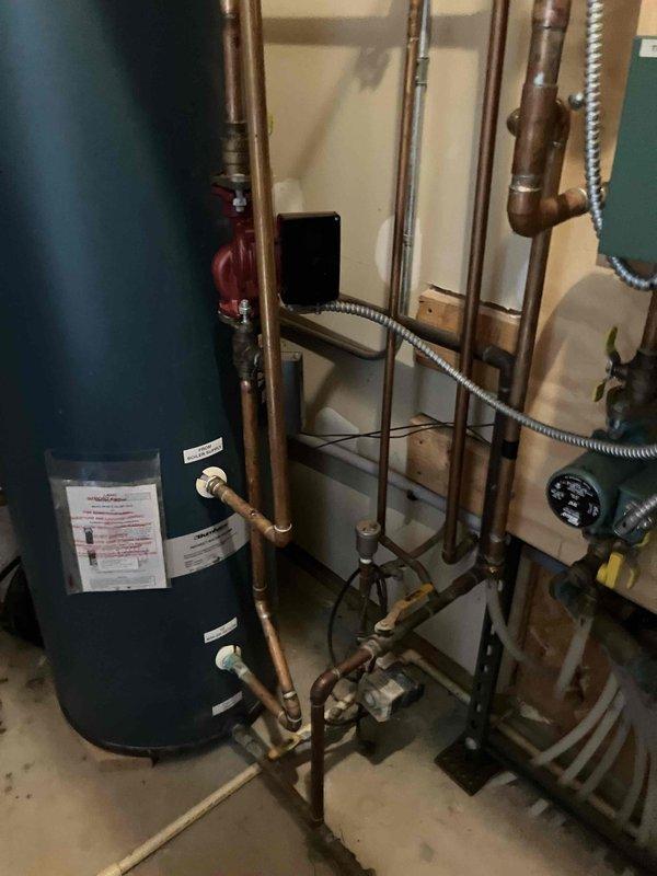 Completed annual preventive maintenance on residential hydronic heating system and indirect water heater. Performed comprehensive inspection of multi-zone heating system including four circulation pumps, zone control boards, copper piping network, expansion tank, and associated ball valves. Inspected indirect water heater and all connections, verified proper operation of pressure relief valve and system controls. All components found operating within normal parameters. Provided estimate for recommended services. Customer requested second annual maintenance visit be scheduled for fall season prior to heating demand period.