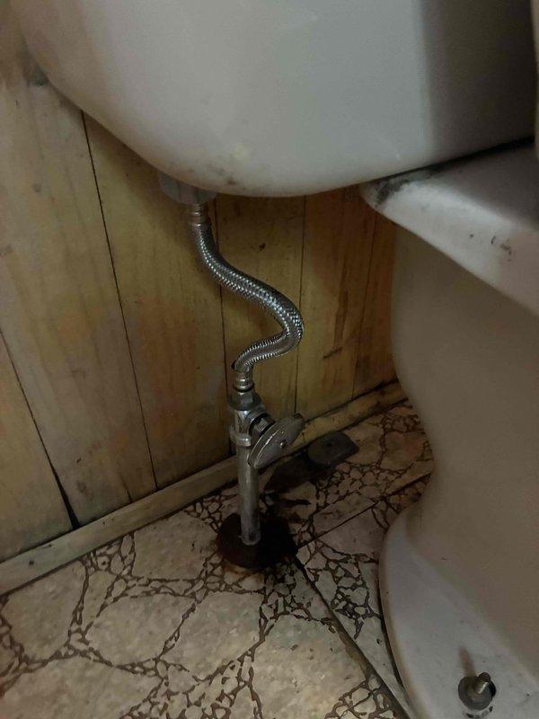 Completed cottage de-winterization service for single bathroom unit. Removed and replaced old toilet due to age and wear, installing new white porcelain fixture with updated components. Replaced deteriorated ball valve with new chrome shut-off valve and flexible braided metal supply line to ensure proper water flow control and prevent potential leaks. All plumbing connections tested and verified operational for seasonal reopening.