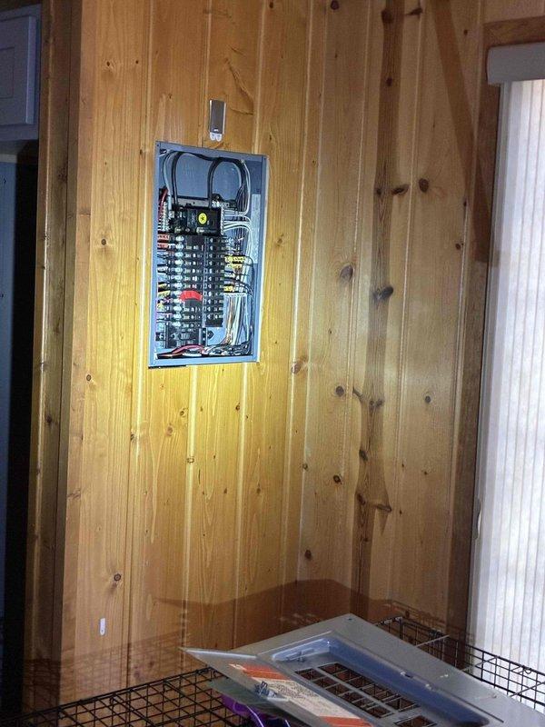 Responded to cottage de-winterization request but determined ambient temperatures were too cold to safely proceed with opening procedures. Assessed property conditions and documented electrical panel and interior construction areas, advising customer to postpone cottage opening until warmer weather arrives to prevent potential freeze damage to plumbing systems.