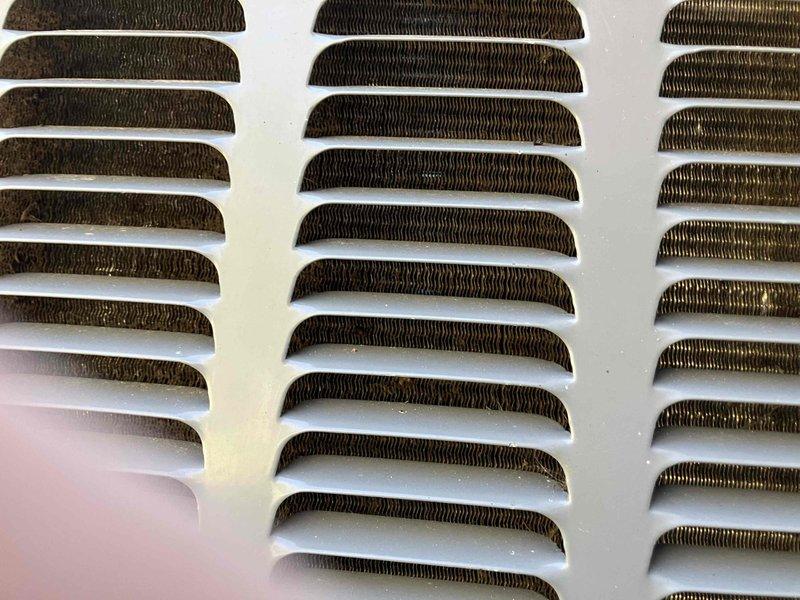 Completed annual prepaid maintenance on air conditioning system. Performed visual inspection of evaporator coil through access grille, noting moderate dust and dirt accumulation on heat exchanger fins requiring attention during next service interval. System operational at time of inspection.