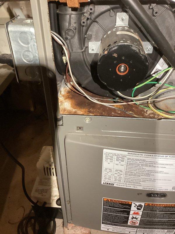 Responded to no heat call on 15-year-old Lennox LP furnace. Upon inspection, diagnosed restricted venting system preventing proper exhaust flow and failed gas valve preventing burner operation. Documented system conditions with photos showing interior components, motor assembly, and manufacturer data plate. Provided customer with repair versus replacement options and quoted air handler upgrade.