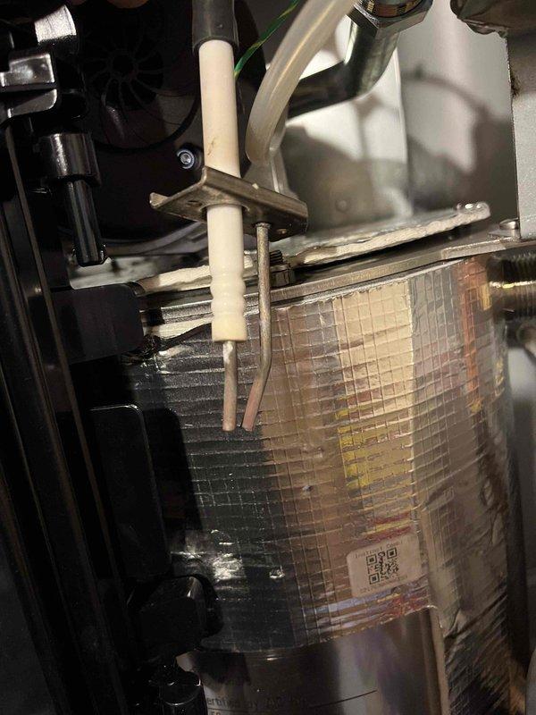 Completed Partner Plan annual maintenance inspection on boiler system. Found combustion levels outside of manufacturer specifications and performed necessary adjustments to bring all readings back within proper parameters. Verified system operation and documented equipment condition with photos showing heat exchanger assembly and pressure measurements using calibrated digital manometer reading -04.67 inches of water column.