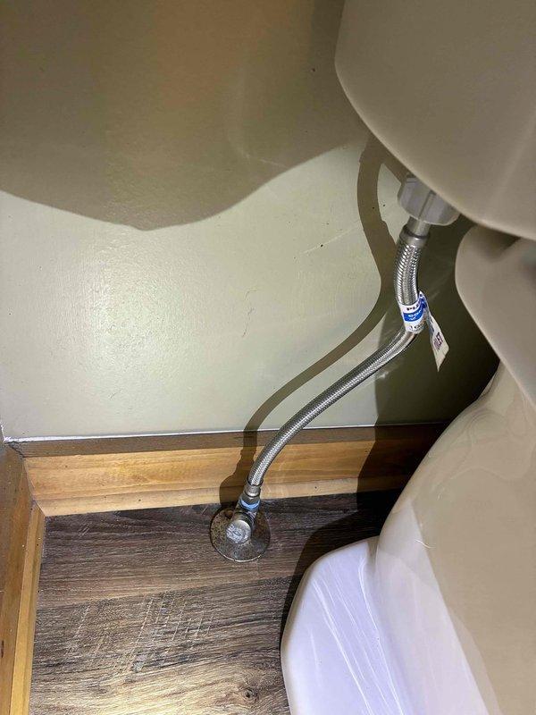 Completed toilet installation at residential property with no complications encountered. Connected new flexible braided stainless steel water supply line from wall-mounted shut-off valve to toilet tank inlet, ensuring proper seal and functionality. Verified all connections for leaks and confirmed proper operation of the fixture upon completion.