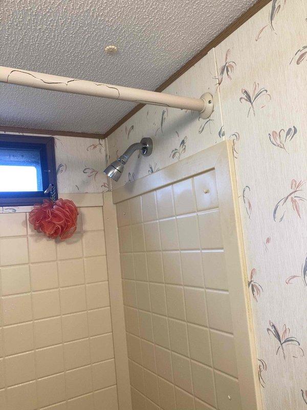 Completed de-winterization service for residential property. Located entry key at exterior fire pit structure as directed, gained access to property, and proceeded with system reactivation. Restored water supply to plumbing fixtures throughout residence, with particular attention to bathroom facilities. Verified proper water flow and operation of shower fixtures, confirming successful completion of seasonal startup procedures without leaks or operational issues.
