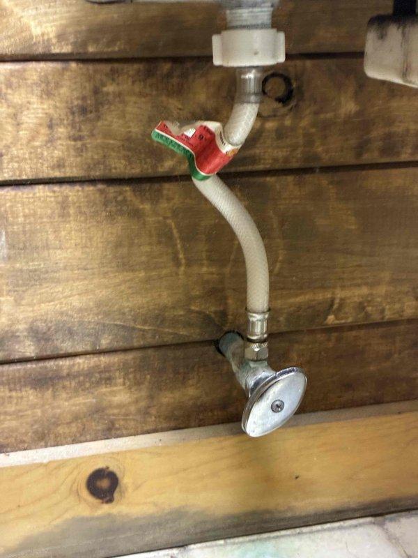 Performed cottage de-winterization service for second bathroom. Removed and replaced aging toilet that showed significant mineral deposits and internal tank deterioration. Installed new two-piece toilet unit with fresh internal flush mechanism and fill valve assembly. Replaced deteriorated gate valve with new red-handled ball valve in the water supply line, which features PEX tubing connections and chrome finish supply fixture. All plumbing connections tested and verified leak-free upon restoration of water service.