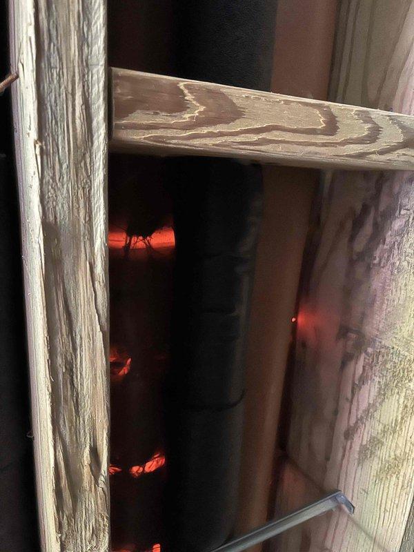 Responded to callback for recent furnace and AC installation regarding uneven temperature distribution throughout the home. Found basement heat outlet vents fully closed, causing cold conditions on lower level while upper level was overheating. Adjusted airflow by partially opening basement vents, leaving main level vents unchanged, and restricting heat flow to upper level vents. Performed diagnostic testing including static pressure and heat rise measurements at both high and low fire settings to verify system performance. Applied insulation to exposed exterior vent piping from furnace that was previously left unprotected.