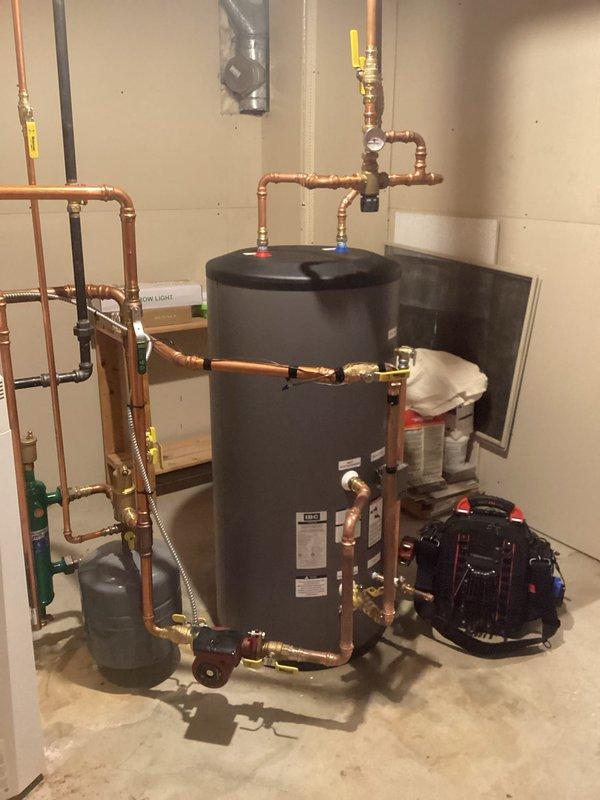 Replaced failed indirect water heater with new IBC 40-gallon indirect unit under warranty coverage. Successfully installed replacement tank with all necessary piping connections, valves, and circulator pump, ensuring proper integration with existing boiler system and domestic hot water distribution. Old unit will be submitted for warranty claim processing.