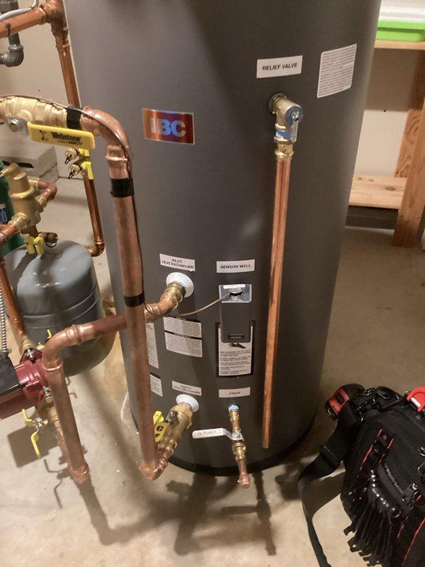 Replaced failed indirect water heater with new IBC 40-gallon indirect unit under warranty coverage. Successfully installed replacement tank with all necessary piping connections, valves, and circulator pump, ensuring proper integration with existing boiler system and domestic hot water distribution. Old unit will be submitted for warranty claim processing.