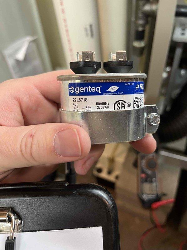 Completed partner plan annual inspection on boiler system. During inspection, identified corroded igniter requiring replacement and inducer motor capacitor reading below manufacturer specifications. Documented equipment condition with photos showing extent of igniter corrosion and capacitor details (Genteq 27L571S, 370VAC). Provided repair estimates to address both identified issues to ensure continued safe and efficient operation of heating system.