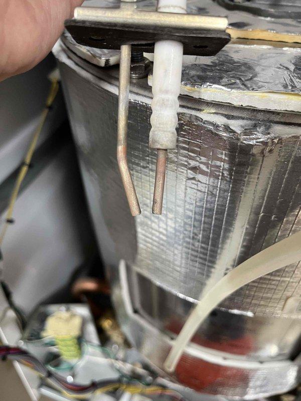 Responded to no heat and no hot water complaint. Inspected boiler and found heavily corroded igniter preventing proper ignition. Combustion analysis revealed off-spec levels indicating buildup in heat exchanger. Discussed options including heat exchanger cleaning versus full system replacement. Customer elected to proceed with system replacement estimates.