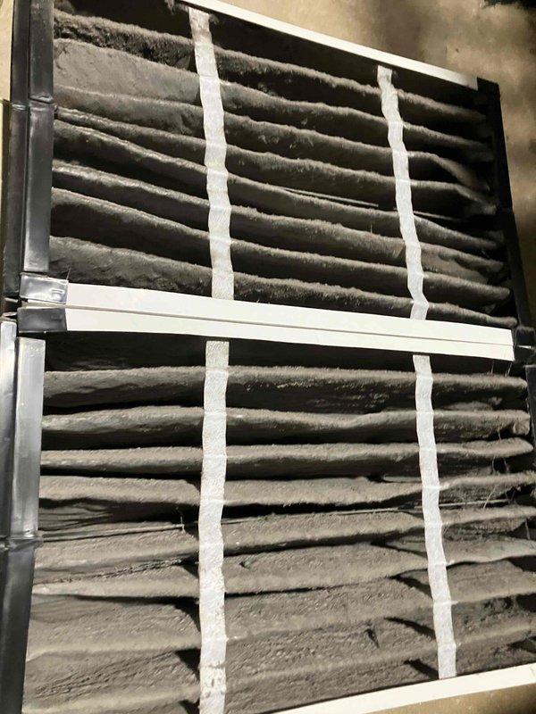 Completed annual heat inspection on 15-year-old furnace as part of prepaid maintenance plan. Found heavily contaminated air filter with excessive dust and debris buildup restricting airflow. Replaced dirty filter with new unit and inspected blower assembly, which showed normal operational wear and functional condition. System restored to proper operating efficiency.