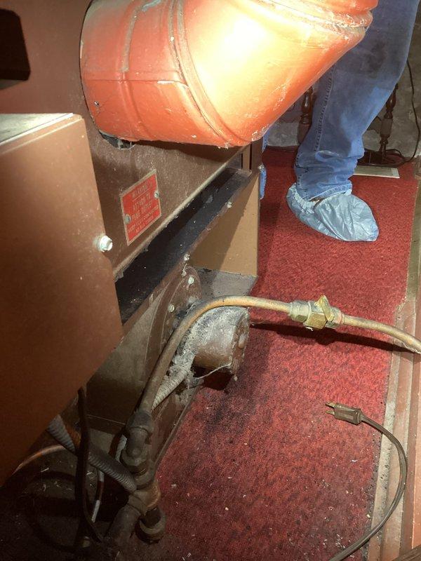 Responded to no heat call and discovered 60-year-old furnace with carbon monoxide leak and heavy soot accumulation on exterior casing. Due to immediate safety hazard and age of equipment, unit was condemned and tagged for replacement. Customer advised of dangerous conditions and system was shut down to prevent further CO exposure.