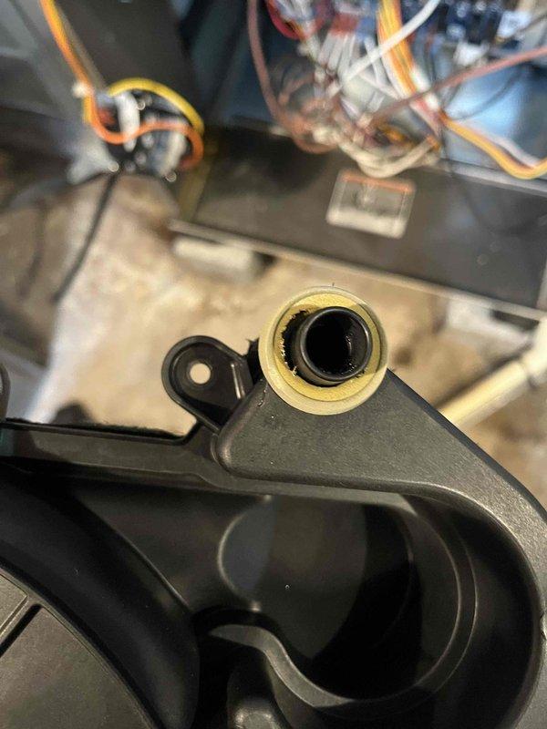 Responded to water leak complaint at furnace location. Upon inspection, discovered damaged gasket at inducer assembly causing water to escape and pool beneath unit. Sealed compromised gasket with RTV sealant to restore proper seal integrity. Removed and cleaned condensate trap, extracting large beetle and accumulated debris that was obstructing proper drainage. Verified condensate pump operation and confirmed all drainage pathways were clear and functioning correctly after repairs.