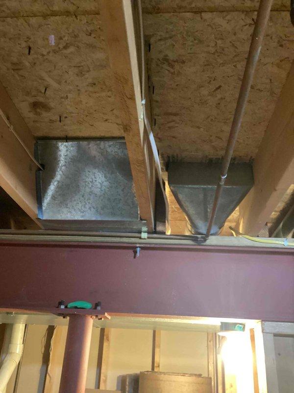 Conducted on-site assessment for comprehensive duct cleaning service involving 17 supply vents, 4 return air vents, and one dryer vent. Inspected accessible ductwork in basement mechanical space, noting galvanized metal duct runs and system configuration throughout the residence. Documented current conditions with photographs and will provide detailed written estimate for complete system cleaning.