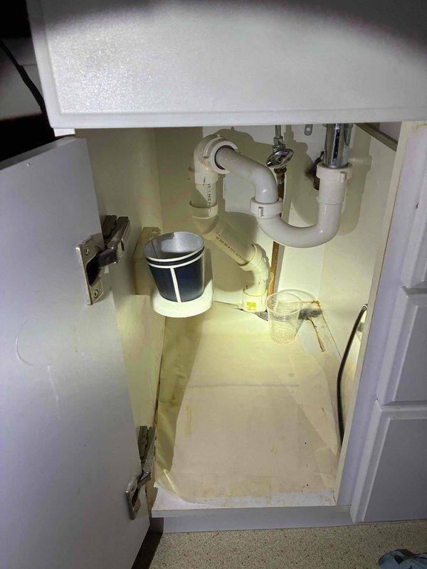 Completed cottage opening and de-winterization service for two-bathroom property. Inspected plumbing systems including under-sink configurations with PVC P-traps, garbage disposal unit, and supply lines in both bathrooms, confirming all connections were secure and operational. Advised customer that boiler was displaying error code requiring attention and recommended monitoring property for signs of pest activity during seasonal opening.