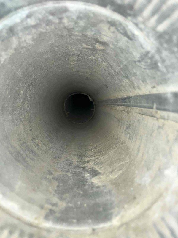 Completed dryer duct and bathroom vent cleaning service. Removed significant accumulation of lint and debris from the rigid metal dryer exhaust duct running from the appliance to exterior termination point. Also cleaned bathroom exhaust vent, which showed heavy dust buildup on interior surfaces. Both ventilation systems are now clear and functioning properly.