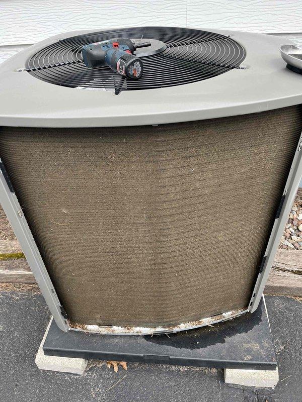 Completed annual partner plan inspection on air conditioning system. Condenser coils exhibited heavy accumulation of pollen, dust, and environmental debris affecting heat transfer efficiency. Thoroughly washed condenser fins to restore proper airflow and system performance.