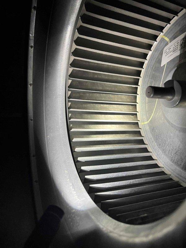 Completed partner plan inspection of AC/mini split system. Inspected blower wheel assembly and found unit operating properly with minimal dust accumulation on components. Verified thermostat functionality showing Zone 2 cooling system running correctly at 67°F with outdoor temperature at 55°F and indoor humidity at 41%. Examined condenser fins and noted very mild buildup present but no immediate cleaning required at this time. All system components functioning within normal parameters.